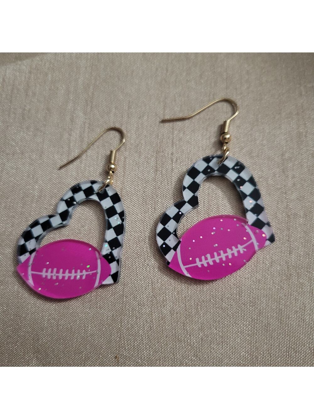 Pink football and checker board heart acrylic earrings